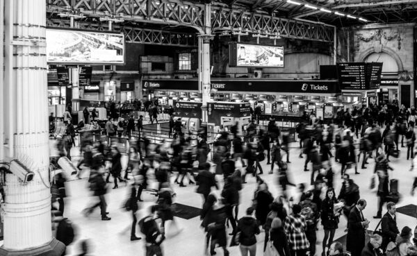 Large amount of people moving through train station